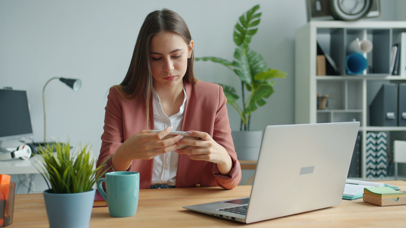 Businesswoman using a smartphone for messaging